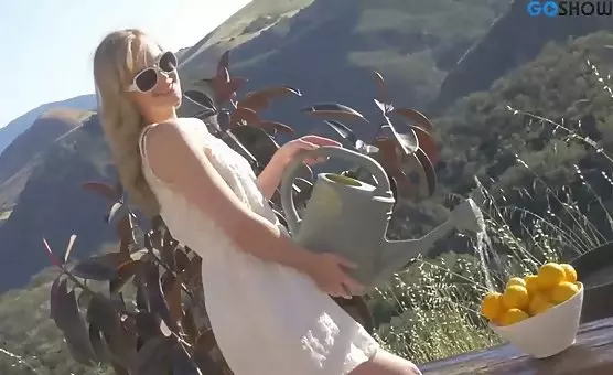 The alluring blonde entices in the sweltering sun